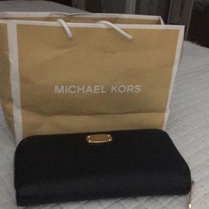 Michael Kors travel wallet.